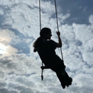 Teenage girl on a swing in Costa Rica during a family vacation