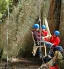 a disabled traveler being assisted on our treeclimbing activity on an accessible adventure in Costa Rica