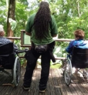 two women in wheelchairs visiting the accessible trails at Carara National Park in Costa Rica