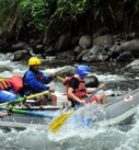 a disabled traveler whitewater rafting on the Pacuare River on an accessible vacation in Costa Rica