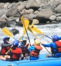 a family whitewater rafting on a multigeneration vacation in Costa Rica