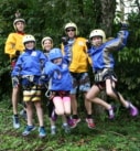 a family enjoying a canyoning adventure during their custom made vacation in Costa Rica