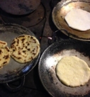 traditional handmade tortillas toasting during a cooking class on a custom vacation in Costa Rica