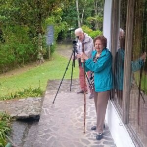 Senior travelers birdwatching in Bosque de Paz