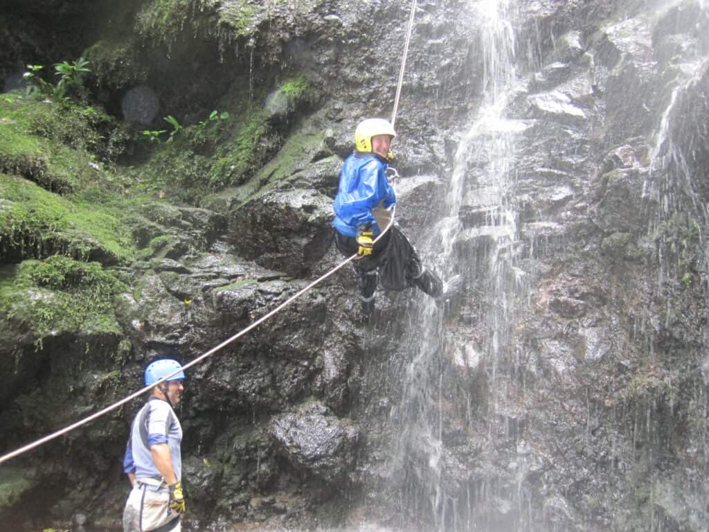 disabled traveler rappelling down a waterfall in Costa Rica