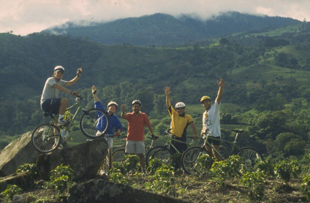 five travellers mountain biking through mountains in Costa Rica